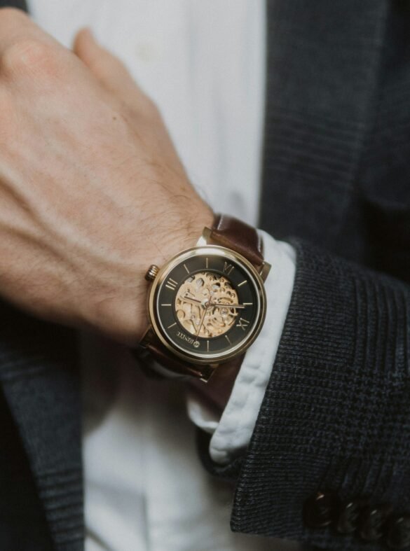 person wearing silver and gold chronograph watch
